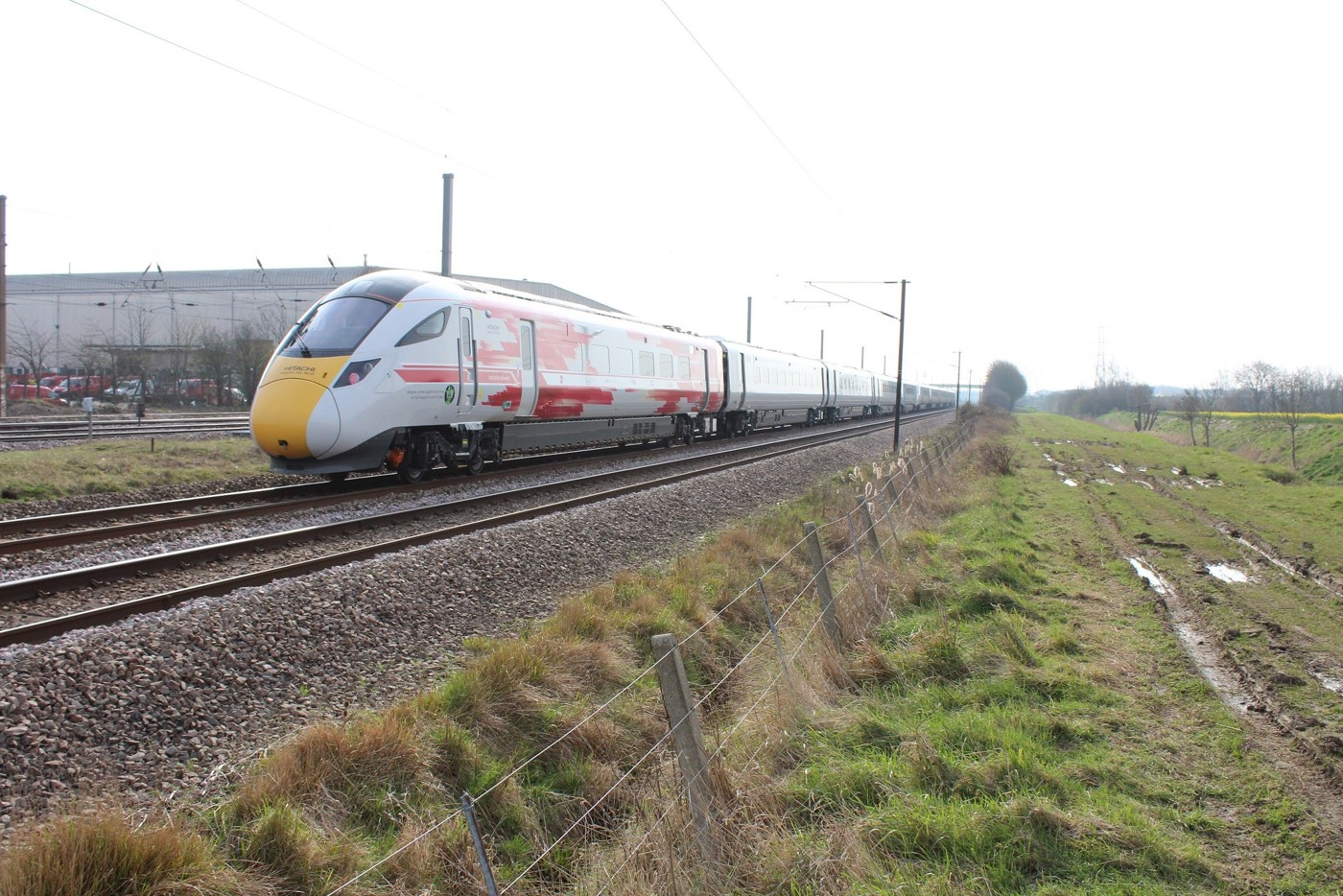 800002 trails 800001 through Marholm, near Peterborough, on April 11, with the 0836 Old Dalby-North Pole. The '800' carries Virgin Trains branding from the official opening of the Newton Aycliffe facility last September. ANDREW WRIGHT. 