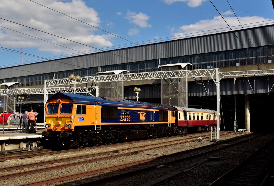 Waiting to leave London Euston on August 13, with the final leg of ‘The Absent Charter’ from Newcastle to Basingstoke, GB Railfreight 66723 Chinook displays its new livery and embellishments. ALEXANDER CROMARTY. 