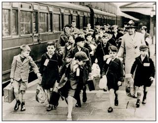 The evacuation of children in the Second World War was the largest mass movement of people in the UK. In September 1939, evacuees with their suitcases and name tags are at Birmingham Moor Street, on their way from the city to safer rural accommodation. ALAMY.