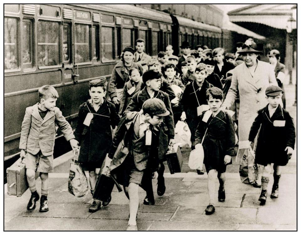 The evacuation of children in the Second World War was the largest mass movement of people in the UK. In September 1939, evacuees with their suitcases and name tags are at Birmingham Moor Street, on their way from the city to safer rural accommodation. ALAMY.