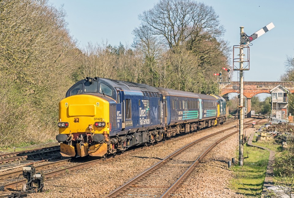 Controlled by soon-to-be-replaced Victorian mechanical signalling, 37407 and (nearest the camera) 37423 accelerate Greater Anglia's 1455 Norwich-Lowestoft away from Reedham on April 18. GLEN BATTEN.