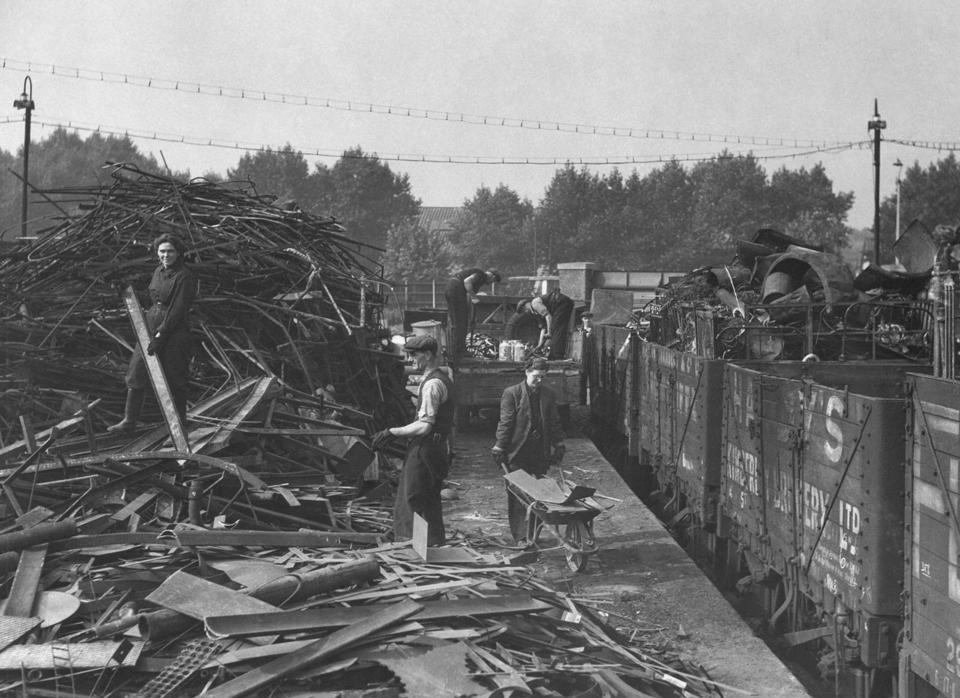 Railways didn’t just provide scrap - they transported it too. Metal is loaded onto wagons ‘somewhere in England’ during 1941. ALAMY