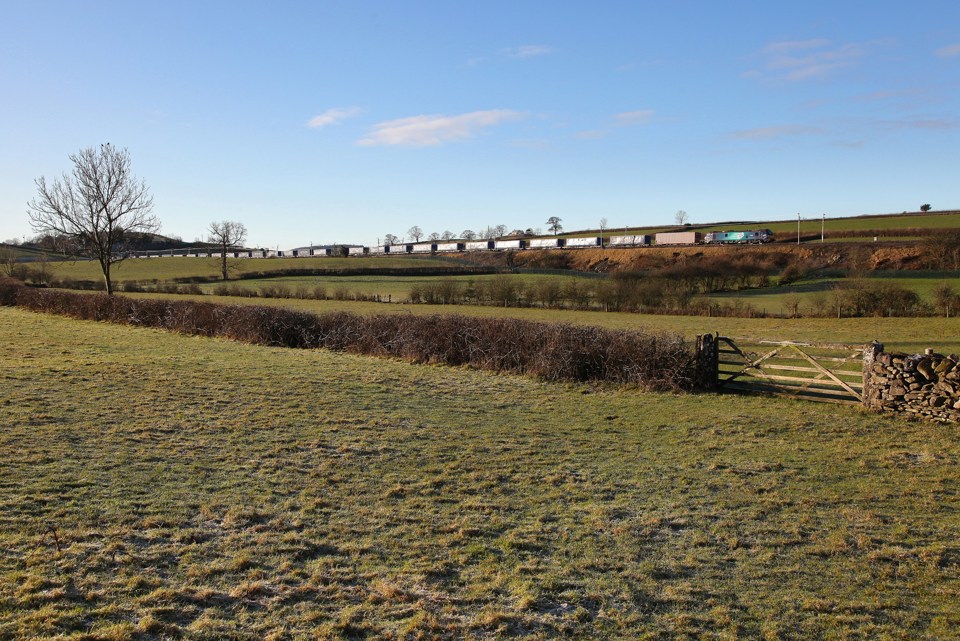 Direct Rail Services 88005 passes Deepthwaite near Milnthorpe on December 11, with the Daventry-Mossend intermodal. PHIL METCALFE.