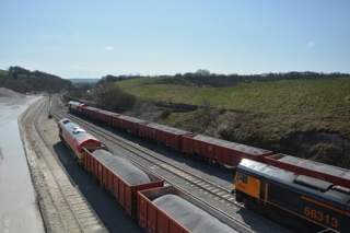 Three freight trains wait to depart Cemex's terminal at Dove Holes Quarry near Buxton. DAVID STUBBINGS.