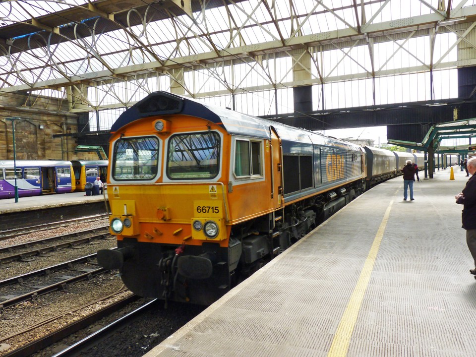 GBRf 66715 passes Carlisle on May 21 2015, with a northbound coal train. RICHARD CLINNICK.