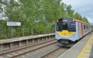 Transport for Wales 230010 arrives at Hawarden Bridge station on May 29 with the 1236 Bidston-Wrexham General. The Welsh Government is proposing to close it and open a test station nearby which would serve Deeside Industrial Park as part of its Network North Wales project. CHRIS HOWE.