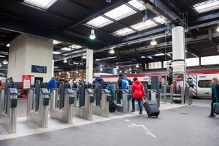 Passengers pass through a ticket barrier at London Euston on December 1. JACK BOSKETT/RAIL.