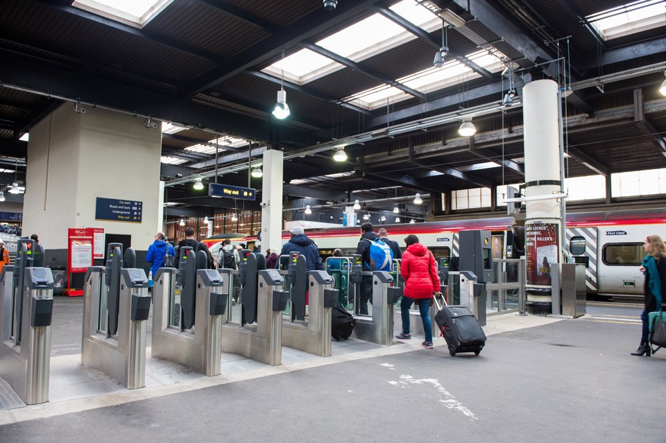 Passengers pass through a ticket barrier at London Euston on December 1. JACK BOSKETT/RAIL.