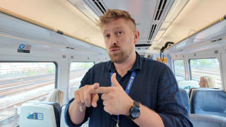 Marcus Oaten, from Signapse, explains how the AI translator works on board a Class 159 from London Waterloo to Exeter. Marcus, who is deaf, communicates using British Sign Language. PAUL CLIFTON.