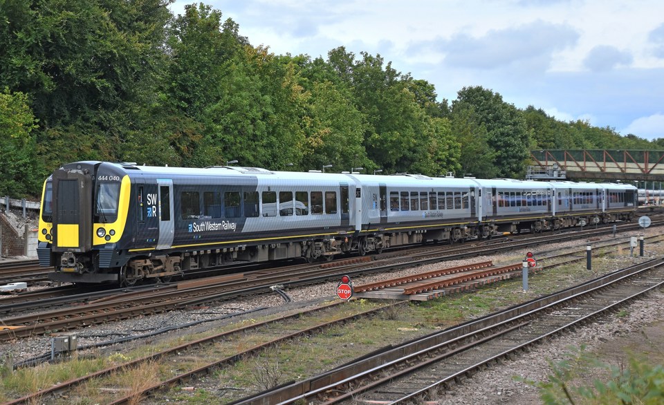SWR 444040 carrying the operator's new livery, passes Basingstoke on September 4.  MARK PIKE.