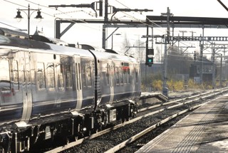 ScotRail 385109 leaves Stirling with December 10 2018's 1047 Alloa-Glasgow Queen Street on the first weekday of electric service from Alloa and Dunblane to Edinburgh and Glasgow. In the distance is Stirling Middle signalbox. PHILIP HAIGH.