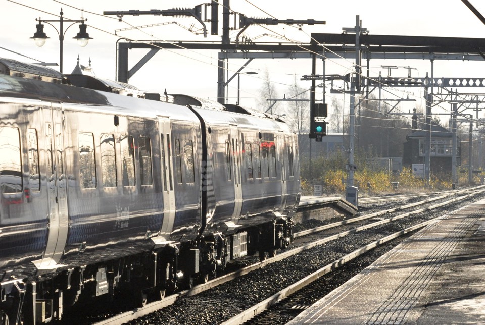 ScotRail 385109 leaves Stirling with December 10 2018's 1047 Alloa-Glasgow Queen Street on the first weekday of electric service from Alloa and Dunblane to Edinburgh and Glasgow. In the distance is Stirling Middle signalbox. PHILIP HAIGH.