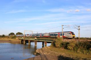 Current annual punctuality on Greater Anglia’s regional and rural routes, operated by bi-mode Class 755s, exceeds 96.5%. The low sun catches GA Class 755 units 755326, 755424 and 755408 crossing Cattawade Bridge over the River Stour on August 29 with the 1730 Norwich-London Liverpool Street service. PAUL BIGGS.