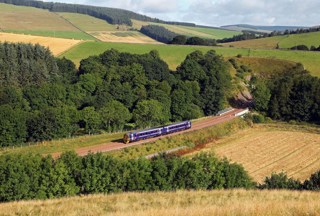 ScotRail 158741 heads out from Bowshank Tunnel on August 10, with the 0753 Edinburgh Waverley-Tweedbank.  PHIL METCALFE.