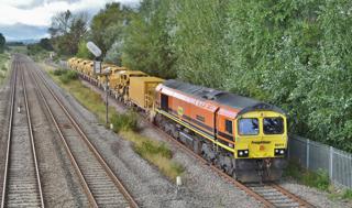 Freightliner 66415 You Are Never Alone returns from the WSR Norton Fitzwarren ballast drop facility, having deposited spent ballast. It will cross the main line to enter Fairwater Yard. Under open access plans, this link could also see passenger trains. STEPHEN GINN.