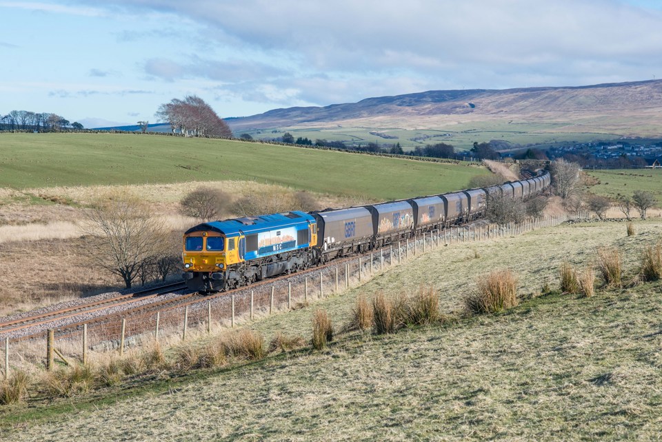 GB Railfreight 66709 Sorrento hauls a loaded coal train north of Bank Junction, near New Cumnock on March 15, with the 1515 Greenburn-Drax Power station. DONALD CAMERON.