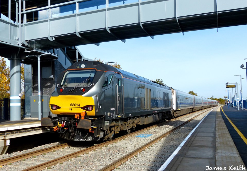 Chiltern Railways 68014 stands at Oxford Parkway on October 25, with the 1035 from, London Marylebone, which was the first Class 68 passenger working to the new station. This is part of the first phase of EastWest and there are concerns the rest of the project could be up to seven years late. JAMES KEITH.