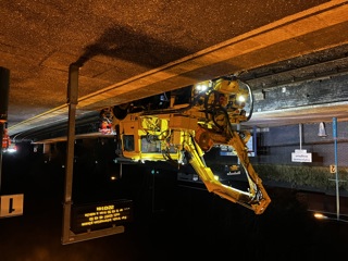 Road-rail vehicle with Mulag saw rolls through Knighton station. DAVID STUBBINGS.