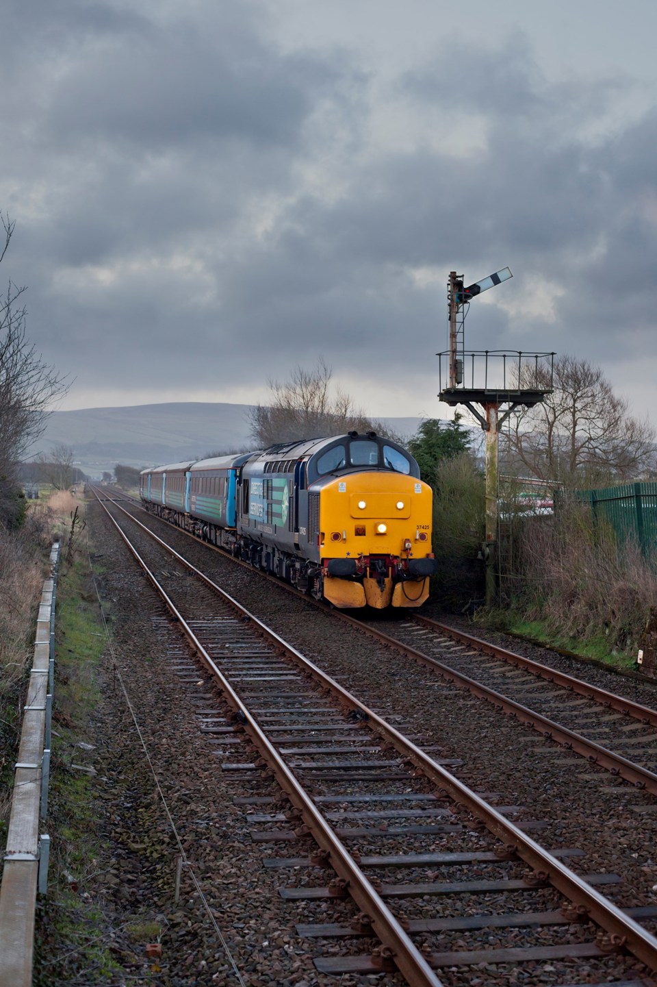 Direct Rail Services 37425 Sir Robert McAlpine/Concrete Bob passes Foxfield on the Cumbrian Coast on March 25, with the 0546 Barrow-in-Furness-Carlisle. ROBERT FRANCE.