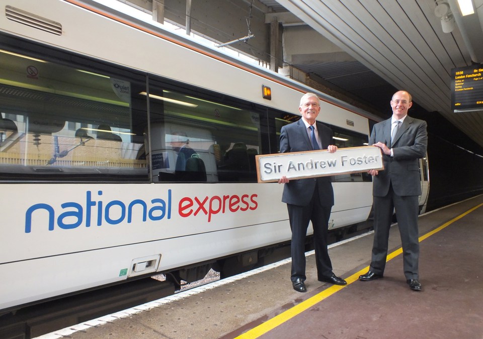 Sir Andrew Foster (left) and Dean Finch (right) stand with 357007 at London Fenchurch Street.