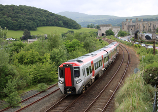  Transport for Wales 197102 runs on the North Wales Main Line between Llandudno Junction and Conwy on June 9 2022. ALAMY.