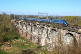 TransPennine Express 802203 crosses Sankey Viaduct with the 0824 Liverpool Lime Street-Newcastle on April 9 2023. TPE is one of the operators currently under the control of the DfT’s Operator of Last Resort - so effectively under public ownership. JAMIE SQUIBBS.