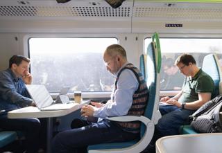 Passengers working on a train