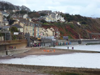 CrossCountry 221121 passes First Great Western 150234 at Dawlish on April 4 2014. RICHARD CLINNICK.