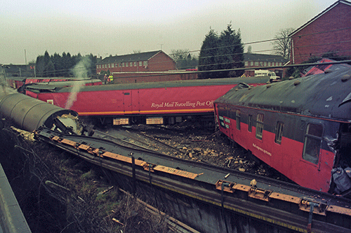 The crumpled wreckage of the Birmingham-Glasgow TPO at Rickerscote in March 1996. The collision claimed the life of a postal worker. PRESS ASSOCIATION.